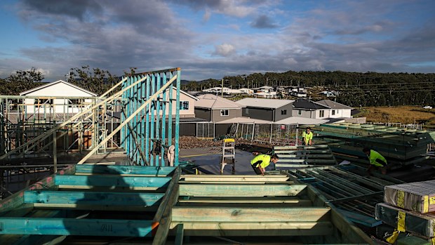 Workers labour on a building site