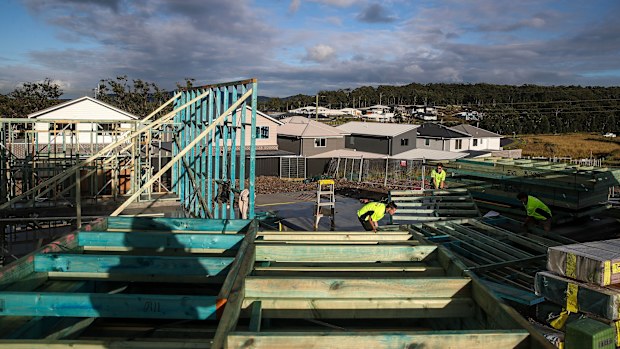 Workers labour on a building site
