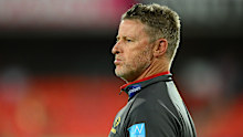 Gold Coast Suns head coach Damien Hardwick looks on.