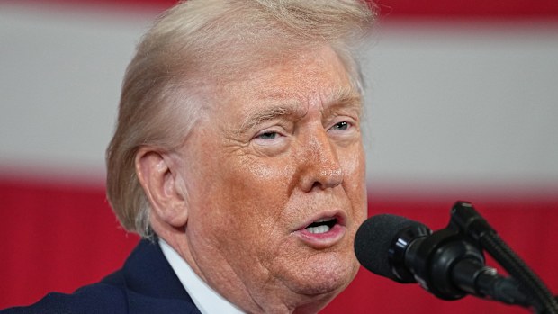 President Donald Trump on Thursday pardoned five former professional football players, including one posthumously.