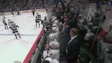 NHL head coach showered in glass. 