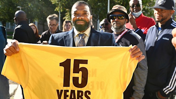 Juwan Deering holds a t-shirt from the National Organization of Exonerees that displays the amount of time her served in prison after he was released from custody. 