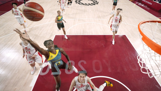 Australia's Ezi Magbegor drives to the basket against China.