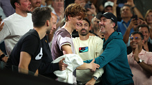Jannik Sinner celebrates the Australian Open with coach Darren Cahill and his team.