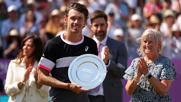 Alex De Minaur of Australia poses with his runners-up trophy after defeat to Carlos Alcaraz of Spain at The Queen's Club.