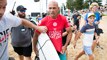 Kelly Slater emerges from the water after competing in the Vissla Sydney Surf Pro at Manly Beach, Sydney in 2019.