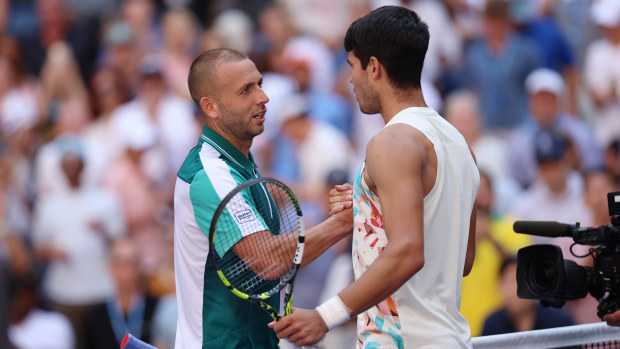 Daniel Evans (L) of Great Britain shakes hands with Carlos Alcaraz of Spain after being defeated in their Men's Singles Third Round match on Day Six of the 2023 US Open at the USTA Billie Jean King National Tennis Center on September 02, 2023 in the Flushing neighborhood of the Queens borough of New York City. (Photo by Clive Brunskill/Getty Images)