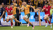 Tom Wright of the Wallabies makes a break to score a try during the men's International Test match between Australia and Wales.
