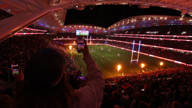 Players run onto the field for the start of the the round 25 NRL match between the Sydney Roosters and the South Sydney Rabbitohs. 