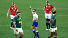 Australian referee Nic Berry awards a penalty to the British and Irish Lions.