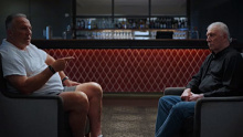 Ian Botham and Ian Chappell sit across from each other during filming for The Longest Feud.
