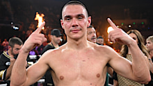 Tim Tszyu shows off his prized possession after his win.