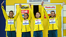 Gold medallists Emma McKeon, Chelsea Hodges, Mollie O'Callaghan and Madison Wilson celebrate during the medal ceremony.
