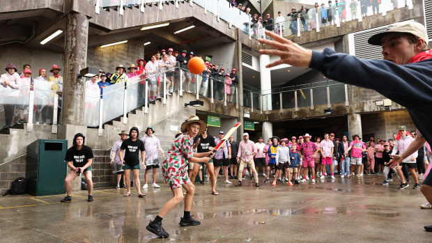 Spectators play cricket during a rain delay during day three of the Second Test match in the series between Australia and South Africa at Sydney Cricket Ground on January 06, 2023 in Sydney, Australia. (Photo by Cameron Spencer/Getty Images)