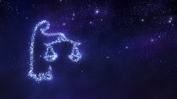 Libra zodiac sign on space background