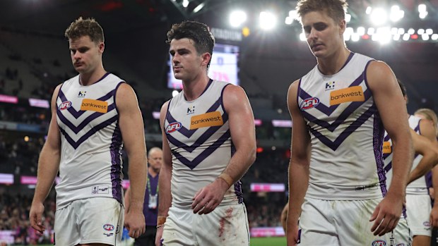 Freo players leave the field following the loss to St Kilda