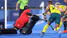 Tim Brand of Australia scores at Oi Hockey Stadium.