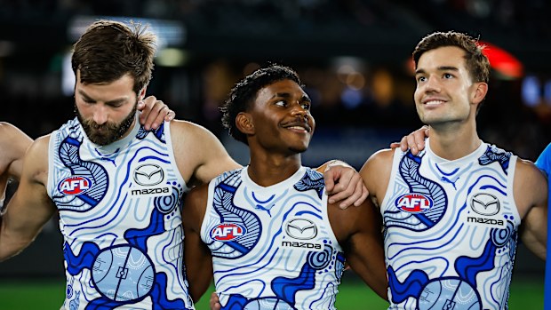 Luke McDonald, Phoenix Spicer and Jy Simpkin of the Kangaroos are seen during the 2023 AFL Round 11 match.