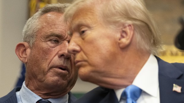 Health and Human Services Secretary Robert F. Kennedy Jr., speaks as President Donald Trump listens in the Roosevelt Room of the White House, Monday, Sept. 22, 2025, in Washington.