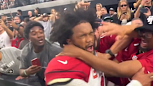 Arizona star Kyler Murray is struck by a fan after the overtime victory over the Raiders in Las Vegas.