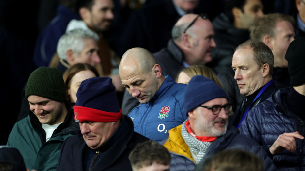 Steve Borthwick, the England head coach, looks dejected as he walks through the crowd.