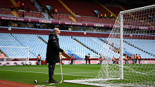 BIRMINGHAM, ENGLAND - DECEMBER 18: Grounds staff take down the goal nets as the game is postponed due to COVID 19 prior to the Premier League match between Aston Villa  and  Burnley at Villa Park on December 18, 2021 in Birmingham, England. (Photo by Clive Mason/Getty Images)