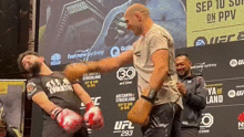 UFC star Sean Strickland spars with an Aussie fan on stage.