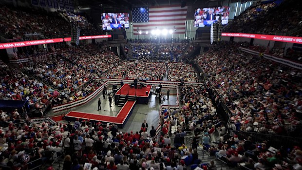 The crowd listens as Republican presidential candidate former President Donald Trump speaks at a campaign rally at Georgia State University in Atlanta, Saturday, Aug. 3, 2024. (AP Photo/John Bazemore)