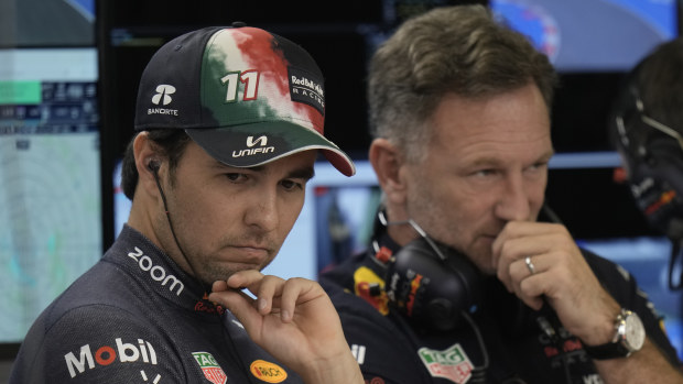 Sergio Perez talks with Red Bull team principal Christian Horner.