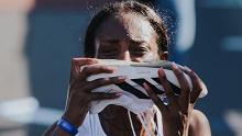 Tigst Assefa kisses her shoe after obliterating the women's marathon record.