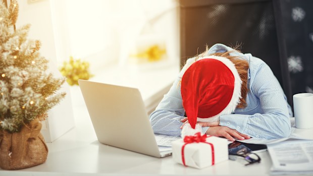 business woman businesswoman freelancer tired, asleep working at computer at Christmas