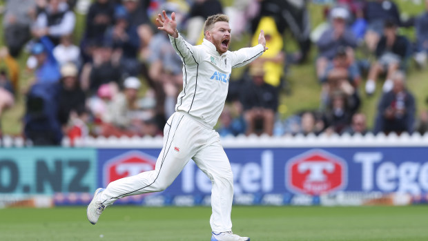 Glenn Phillips of New Zealand celebrates after taking the wicket of Cameron Green of Australia for a five wicket bag during day three of the First Test in the series between New Zealand and Australia at Basin Reserve on March 02, 2024 in Wellington, New Zealand. (Photo by Hagen Hopkins/Getty Images)