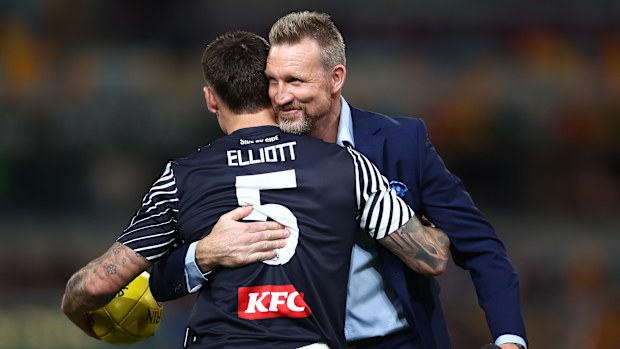 Nathan Buckley embraces Jamie Elliott during the 2025 season.