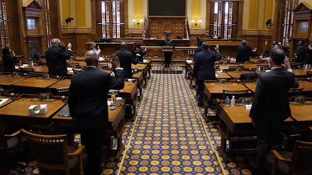 Members of Georgia's Electoral College are sworn in before casting their votes at the state Capitol, Dec. 14, 2020