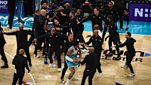 Hornets and Pistons players are separated. 