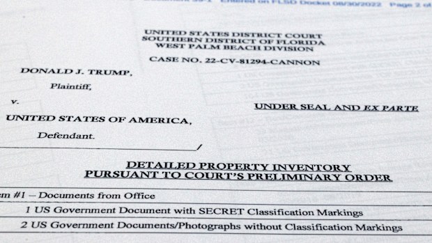 Pages from a FBI property list of items seized from former President Donald Trump's Mar-a-Lago estate and made public by the Department of Justice, are photographed Friday, Sept. 2, 2022. FBI agents who searched the home found empty folders marked with classified banners. The inventory reveals in general terms the contents of the 33 boxes taken during the Aug. 8 search. (AP Photo/Jon Elswick)