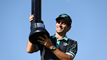 Joaquin Niemann poses for a photo with his trophy after winning the LIV Golf Jeddah Invitational.
