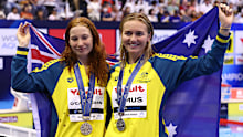 Silver medalist Ariarne Titmus of Team Australia and gold medalist Mollie O'Callaghan pose during the medal ceremony for the Women's 200m freestyle final on day four of the Fukuoka 2023 World Aquatics Championships.