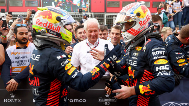 Race winner Sergio Perez of Mexico and Oracle Red Bull Racing and Second placed Max Verstappen of the Netherlands and Oracle Red Bull Racing celebrate  with Red Bull Racing Team Consultant Dr Helmut Marko in parc ferme during the F1 Grand Prix of Azerbaijan at Baku City Circuit on April 30, 2023 in Baku, Azerbaijan. (Photo by Bryn Lennon - Formula 1/Formula 1 via Getty Images)