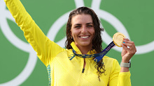Jess Fox celebrates her gold medal at the Tokyo Olympics. 