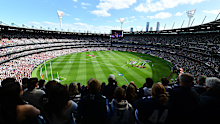 MELBOURNE, AUSTRALIA - SEPTEMBER 27: A general view as players stand for the Welcome to Country and national anthem during the AFL Grand Final match between Geelong Cats and Brisbane Lions at Melbourne Cricket Ground on September 27, 2025 in Melbourne, Australia. (Photo by Josh Chadwick/AFL Photos/via Getty Images)