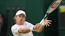 Alex de Minaur of Australia plays a backhand return to compatriot James Duckworth.