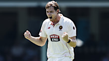Liam Scott celebrates a wicket.