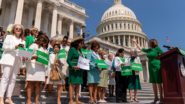 House Speaker Nancy Pelosi of Calif., right, accompanied by female House Democrats, holds an event ahead of a House vote on the Women's Health Protection Act and the Ensuring Women's Right to Reproductive Freedom Act at the Capitol in Washington, Friday, July 15, 2022. (AP Photo/Andrew Harnik)