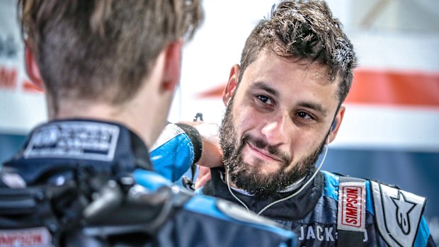 Matt Chahda in the pits talking to Caltex Young Stars teammate Jaylyn Robotham at the Bathurst 1000.
