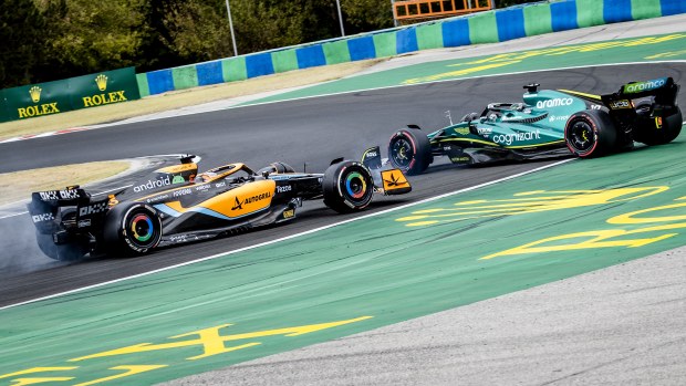 Daniel Ricciardo (3) driving the McLaren MCL36 and Lance Stroll (18) driving the Aston Martin AMR22 during the Hungarian Grand Prix at the Hungaroring Circuit on July 31, 2022 in Budapest, Hungary. REMKO DE WAAL (Photo by ANP via Getty Images)