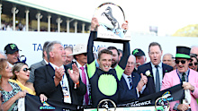 Sam Clipperton celebrates with the 2023 Everest trophy. 