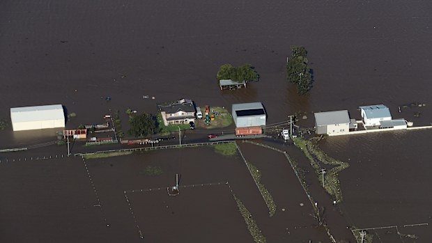 NSW Premier Dominic Perrottet surveys the floods in the Hunter Region in a chopper this morning with Minister for Emergency Services and Resilience and Minister for Flood Recovery Steph Cooke. Pictured is flooding in and around Maitland. Picture: David Swift