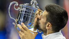Novak Djokovic of Serbia with the winner's trophy after his victory against Daniil Medvedev of Russia in the Men's Singles Final on Arthur Ashe Stadium during the US Open Tennis Championship 2023 at the USTA National Tennis Centre on September 10th, 2023 in Flushing, Queens, New York City.  (Photo by Tim Clayton/Corbis via Getty Images)