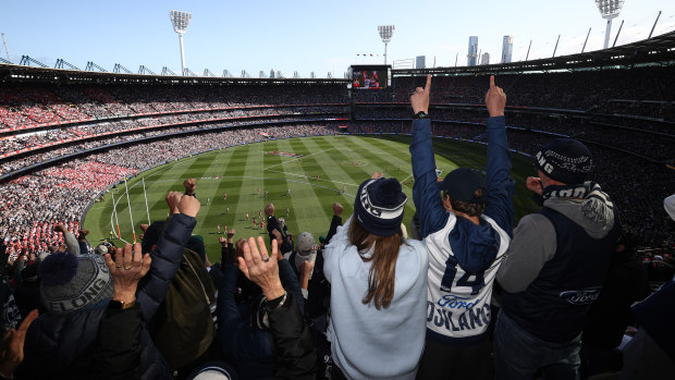 Cats fans celebrate a goal during the 2022 AFL Grand Final match between the Geelong Cats and the Sydney Swans at the Melbourne Cricket Ground on September 24, 2022 in Melbourne, Australia. (Photo by Robert Cianflone/AFL Photos/via Getty Images)